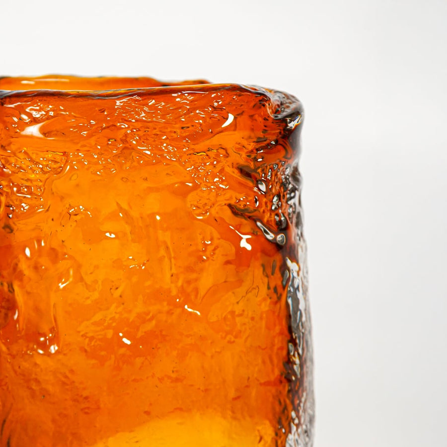 Close up view amber textured glass vase showing handmade surface rich color decorative glass accent for shelf styling home.