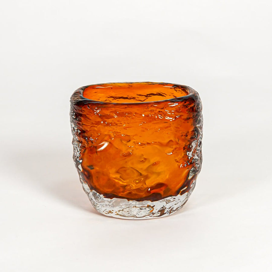 Amber decorative art glass vase on white background modern home decor accent piece for table shelf console styling interior.
