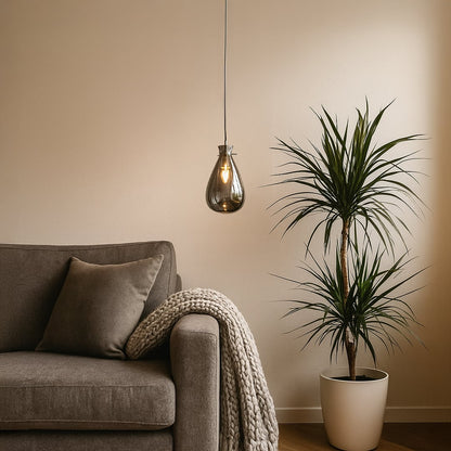 Designer chrome glass pendant light with smooth curved finish perfect for dining rooms bedrooms and modern living room interiors.