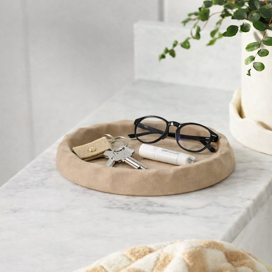 Brown wooden decorative tray placed on table with glasses and accessories modern minimal home decor styling idea.