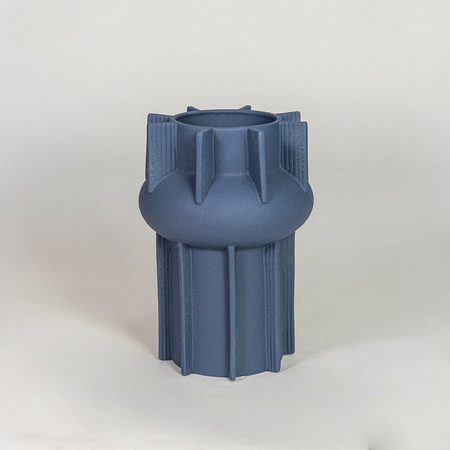 Blue ceramic flower vase with textured modern design decorative vase for tabletop shelf console living room decor styling.