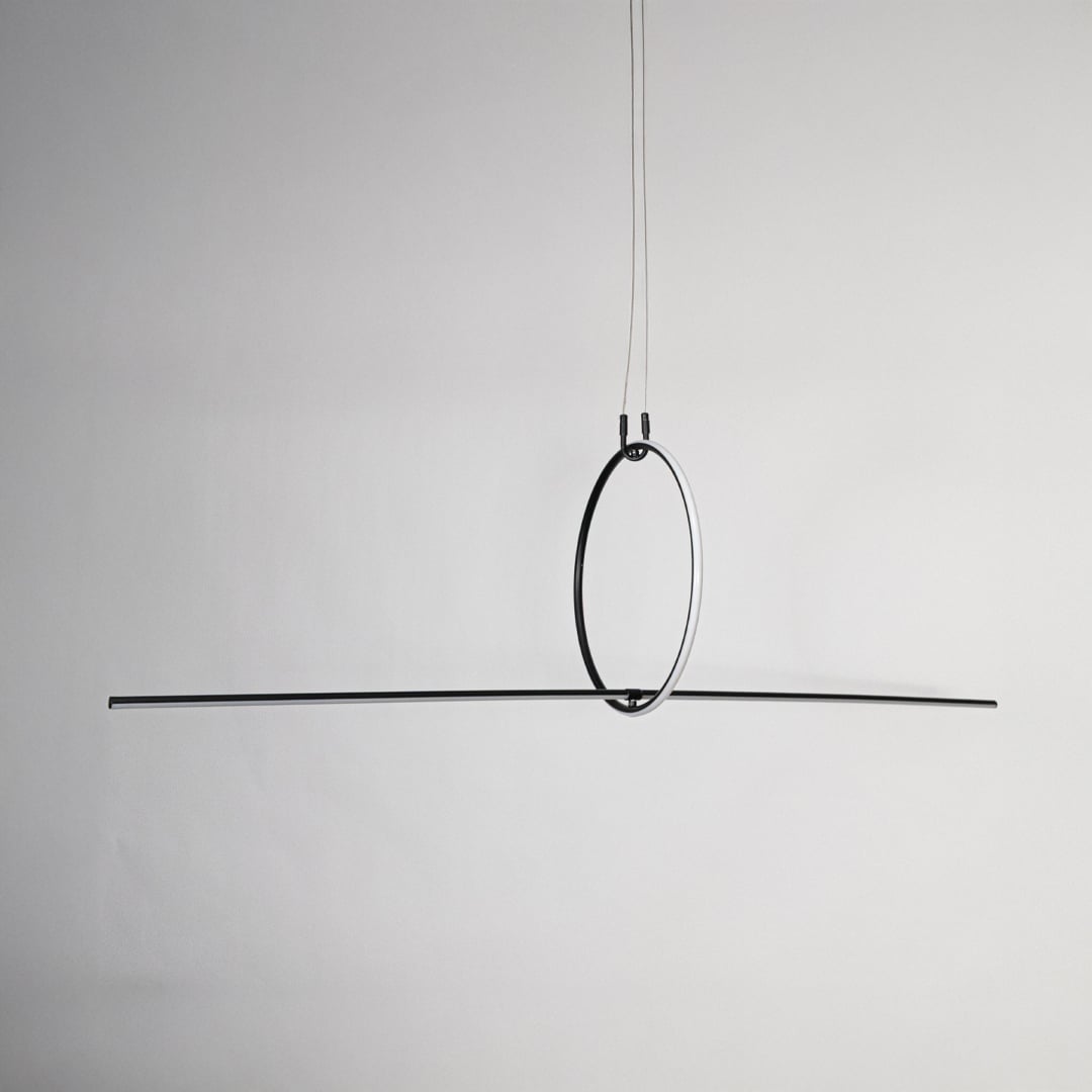 Black linear pendant light displayed on a white background with lights off showing clear minimalist profile.