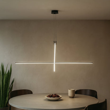 Slim black linear pendant light creating modern ambient lighting in a contemporary interior setting.