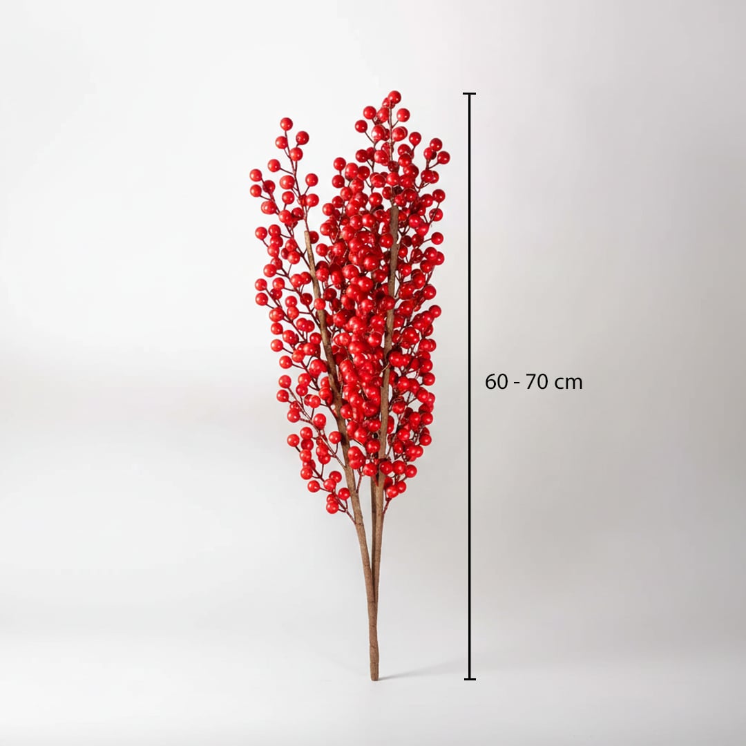 Vibrant red artificial winter berry branch stems showing a sixty to seventy centimeter height chart on white backdrop.