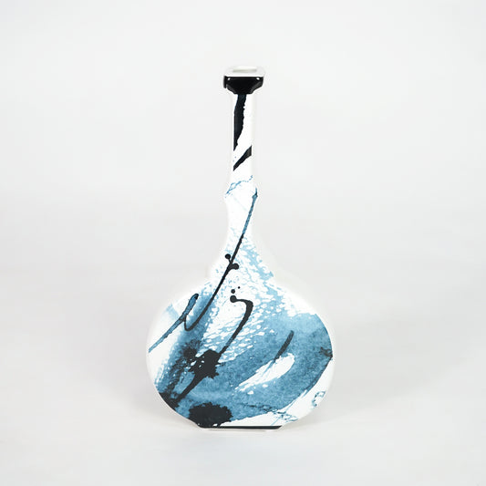 White ceramic vase with blue abstract design for stylish console table placement and modern indoor decor styling.