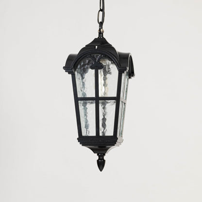 Black outdoor lantern light turned off on white background showcasing elegant shape and clear glass.