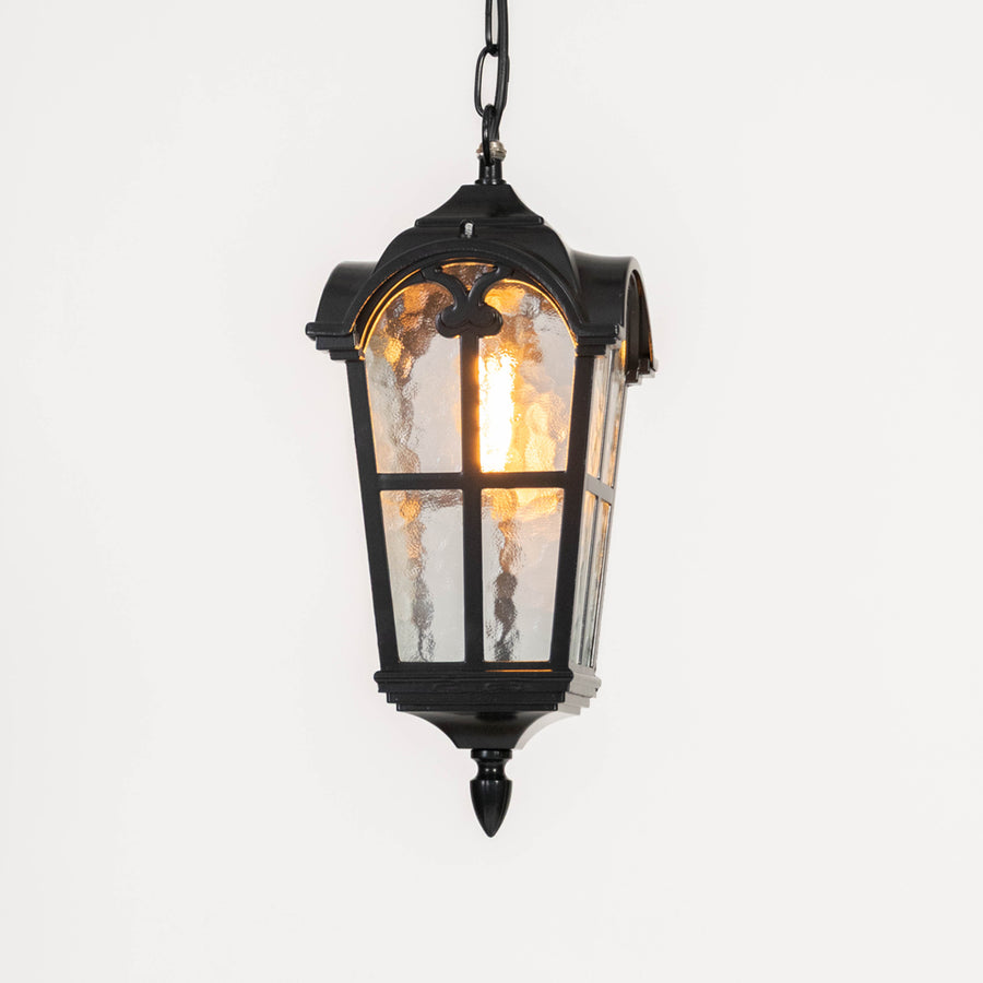 Antique black metal hanging lantern light with textured glass for classic outdoor lighting decor.