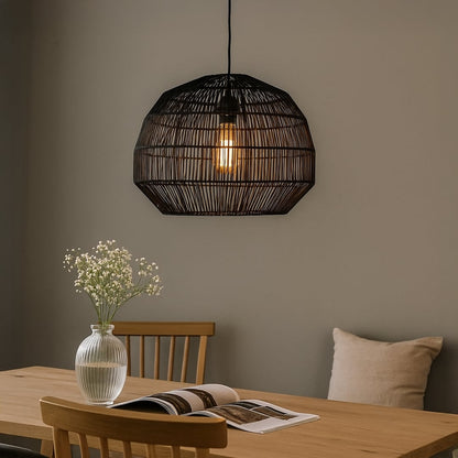 Black rattan pendant light adding a modern bohemian charm to interior decor with its handcrafted design and warm glow.