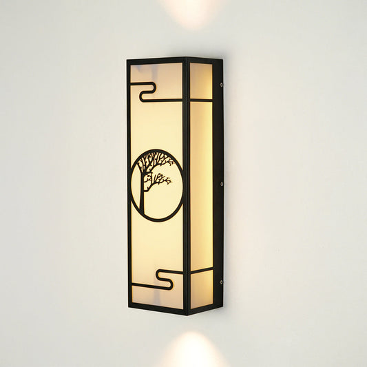 Modern outdoor wall sconce with rectangular metal frame and patterned glass panel on neutral background ideal for porch or entry lighting.