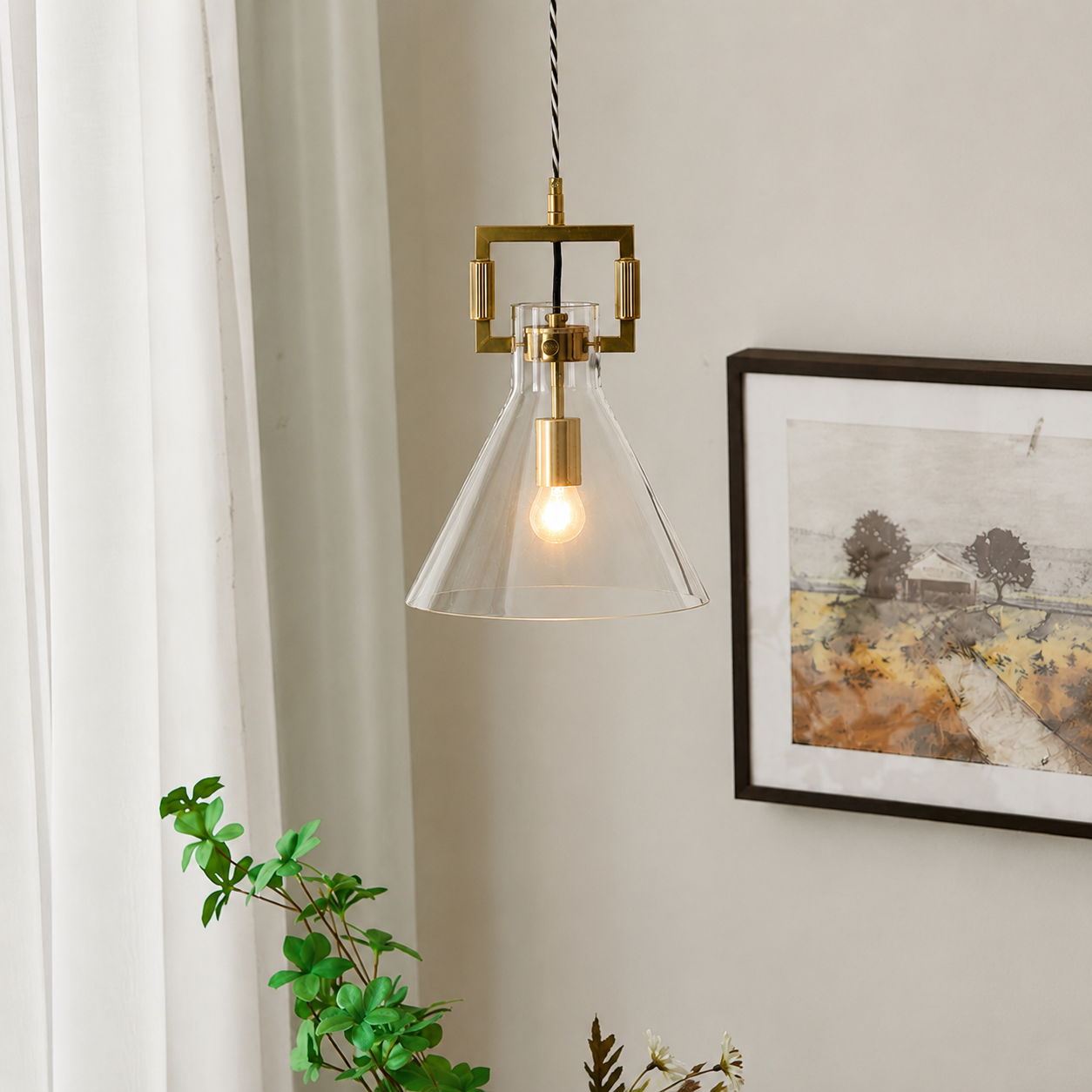 Lifestyle image of aspen clear glass hanging pendant lamp with cone shade for elegant dining room decor styling and modern home lighting design.