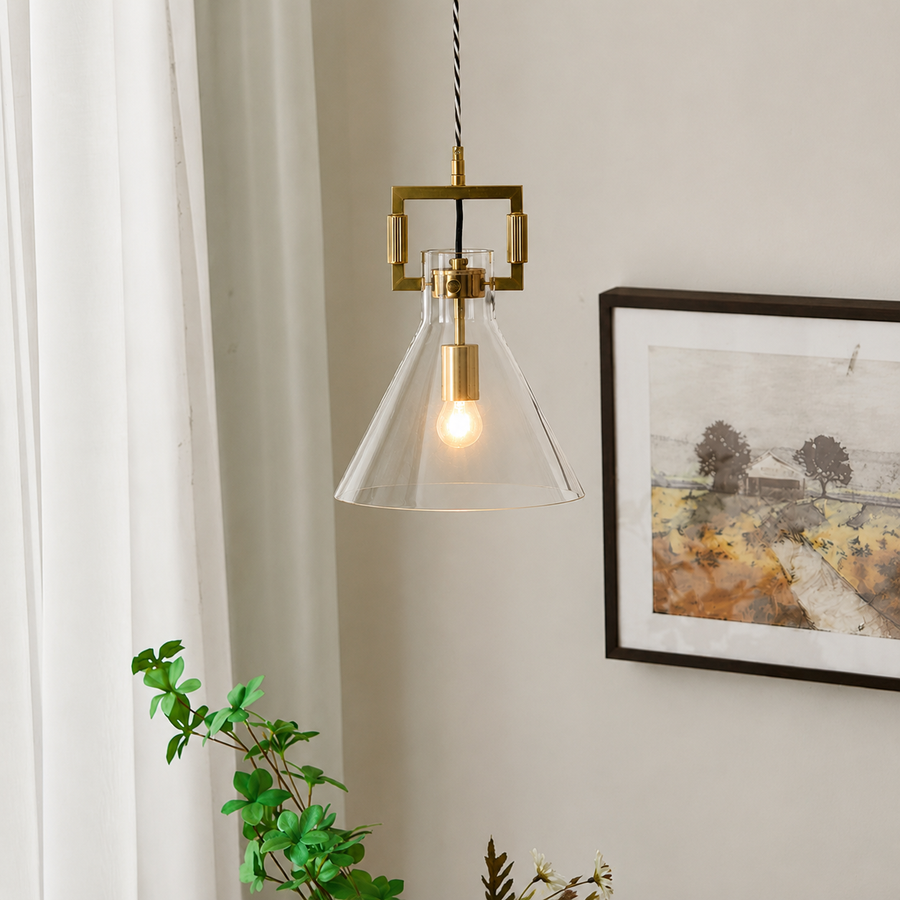 Lifestyle image of aspen clear glass hanging pendant lamp with cone shade for elegant dining room decor styling and modern home lighting design.
