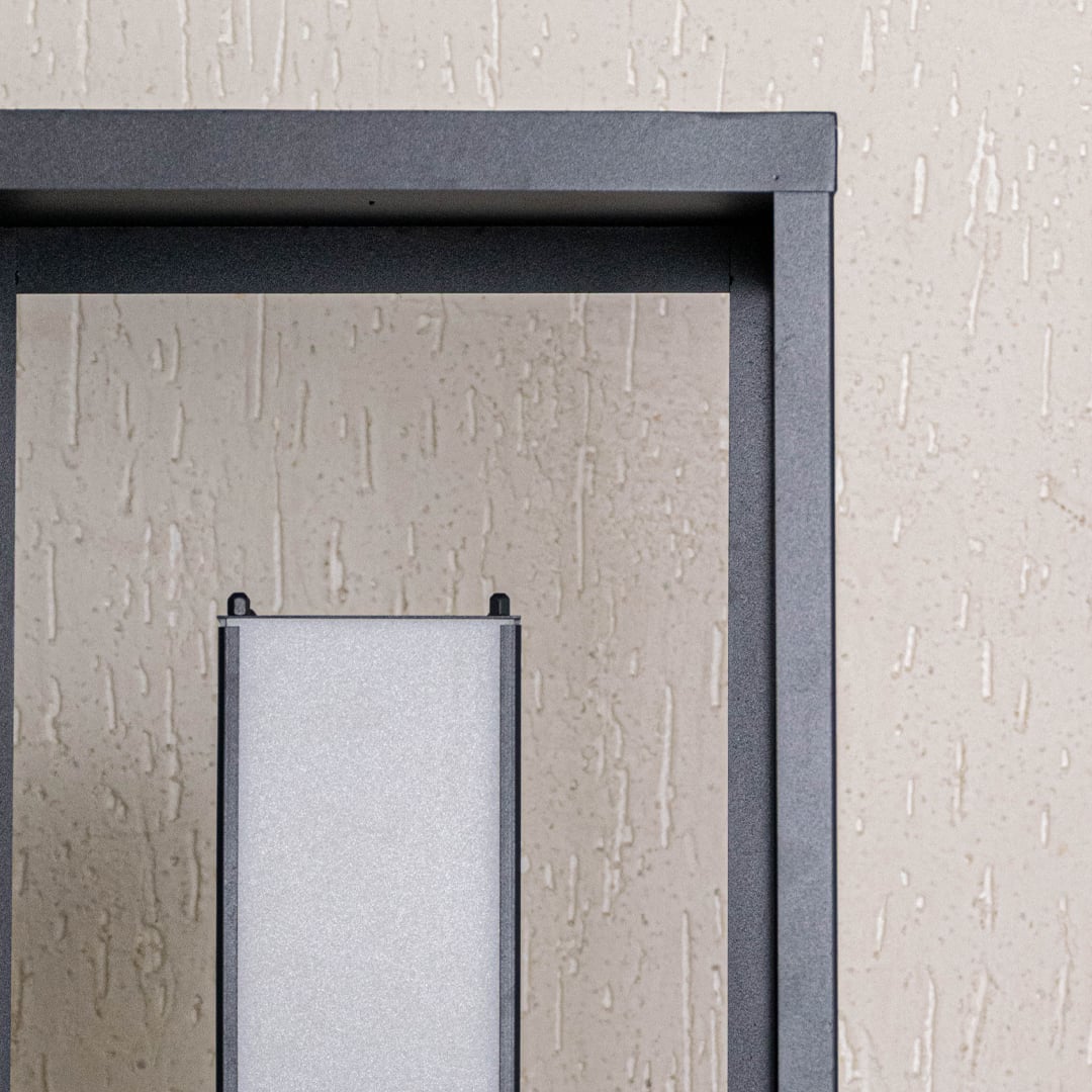 Close view highlighting premium black matte metal texture and refined frosted shade of elegant table lamp.
