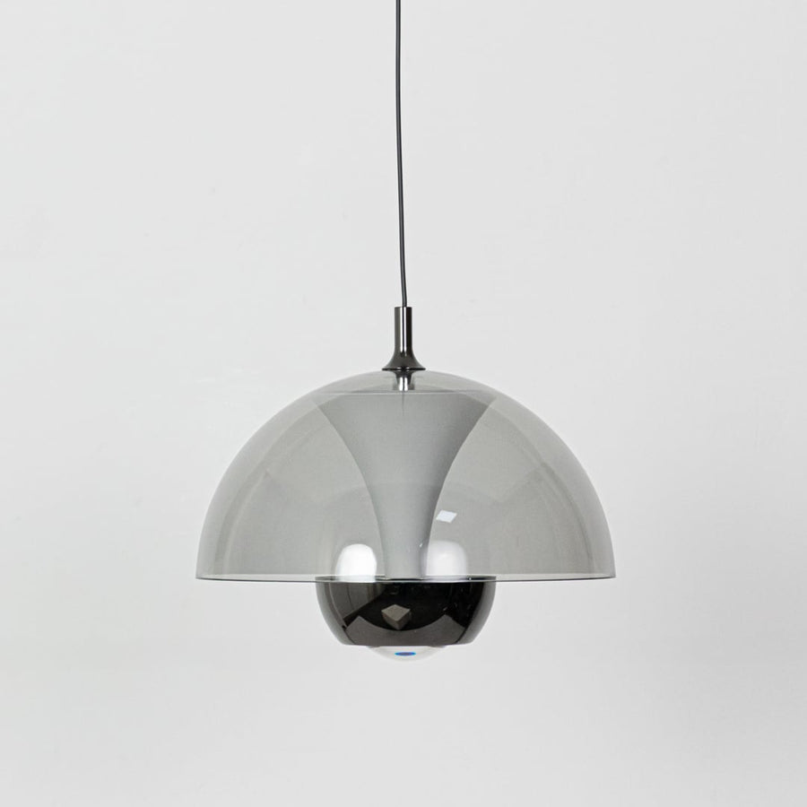 A dome pendant light turned off featuring a smoked grey dome shade and reflective inner globe displayed clearly against a white background.