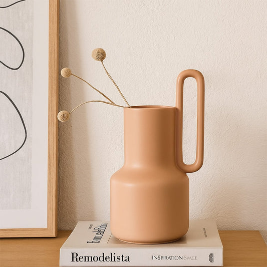 Modern ribbed white ceramic vase styled in a minimal lifestyle setup  highlighting its sculpted shape and clean contemporary design.