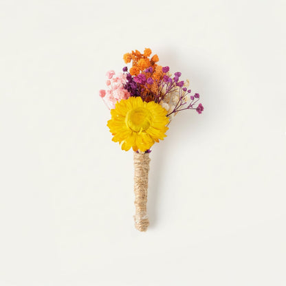 Dried floral stem bouquet with yellow bloom pink purple and orange accents on white background highlighting vibrant color mix handcrafted beauty and decor styling charm.