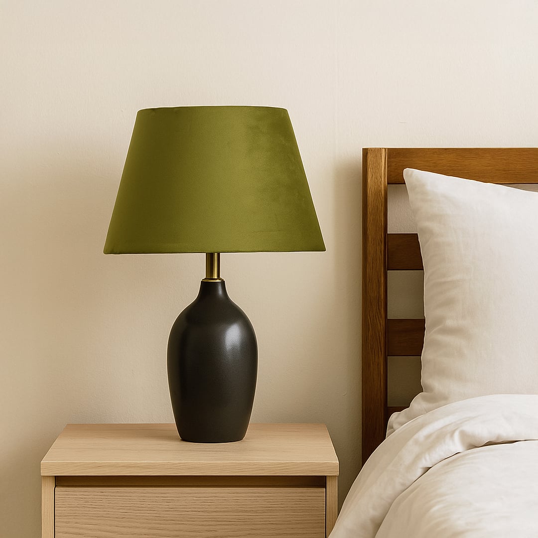 Green velvet lampshade styled in a cozy interior adding soft warm lighting and a rich decorative accent to modern home decor.