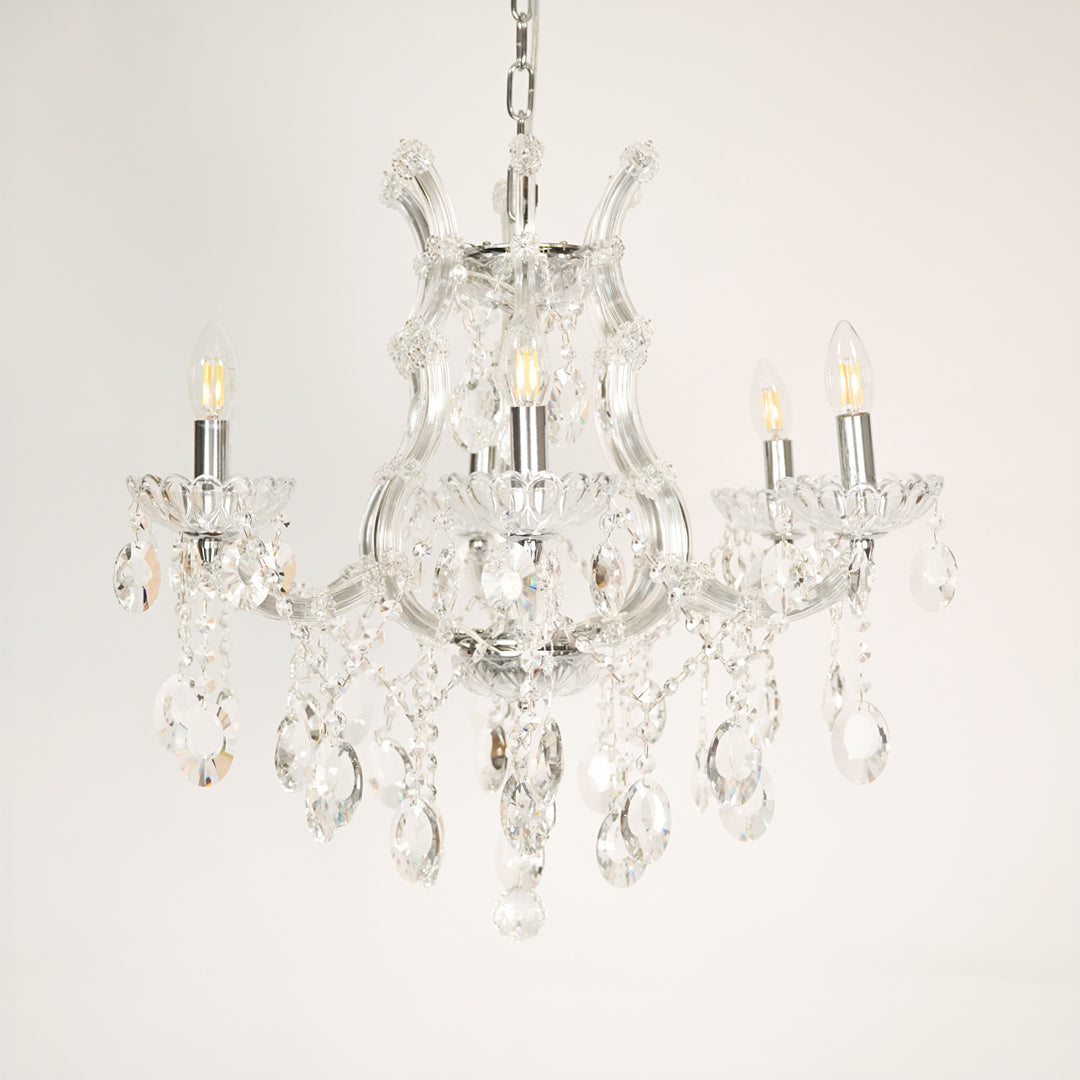 White background image of victorian chandelier for elegant dining room decor styling with unlit arms.
