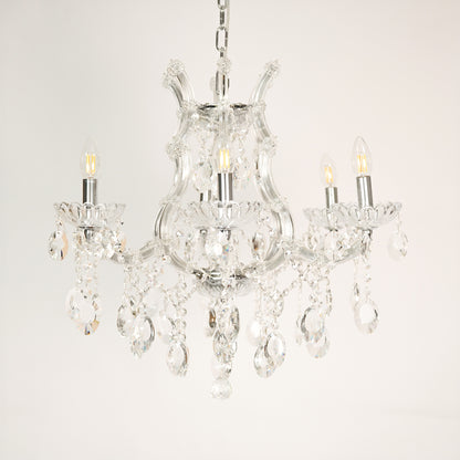 White background image of victorian chandelier for elegant dining room decor styling with unlit arms.