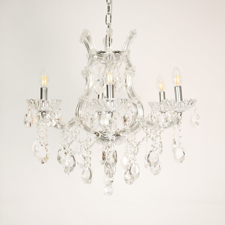 White background image of victorian chandelier for elegant dining room decor styling with unlit arms.