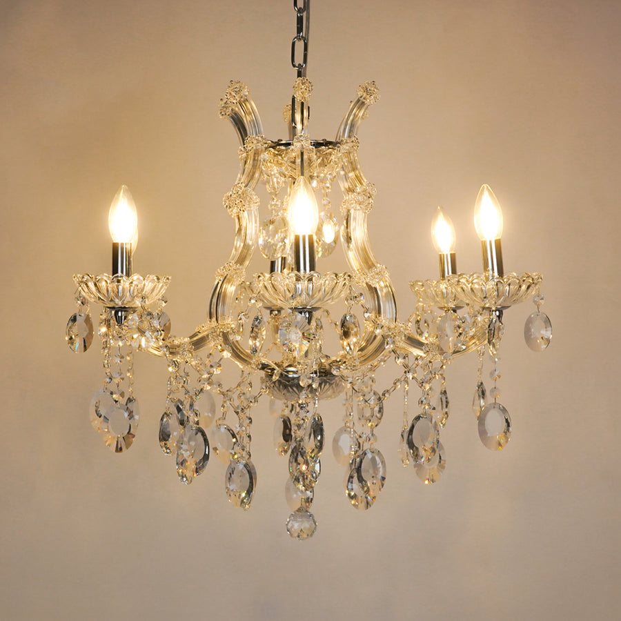White background image of victorian chandelier for modern living room decor styling with a bright warm glow.