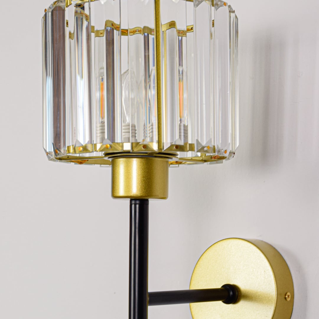 Closeup of black and gold metal wall lamp showing sleek finish refined edges and premium build for elegant indoor wall lighting decor.