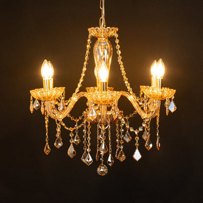 Golden crystal chandelier glowing softly on black background creating a rich luxury statement for elegant ceilings.