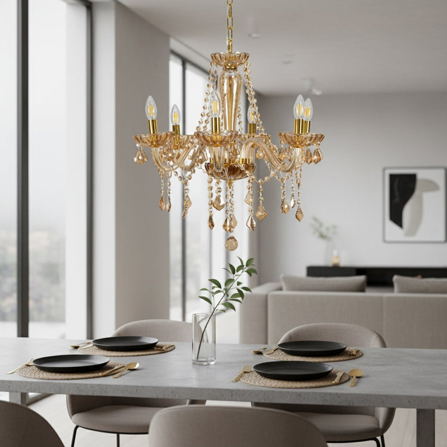 Golden crystal chandelier with elegant arms and warm lighting adds luxury charm to dining room or living room ceilings.