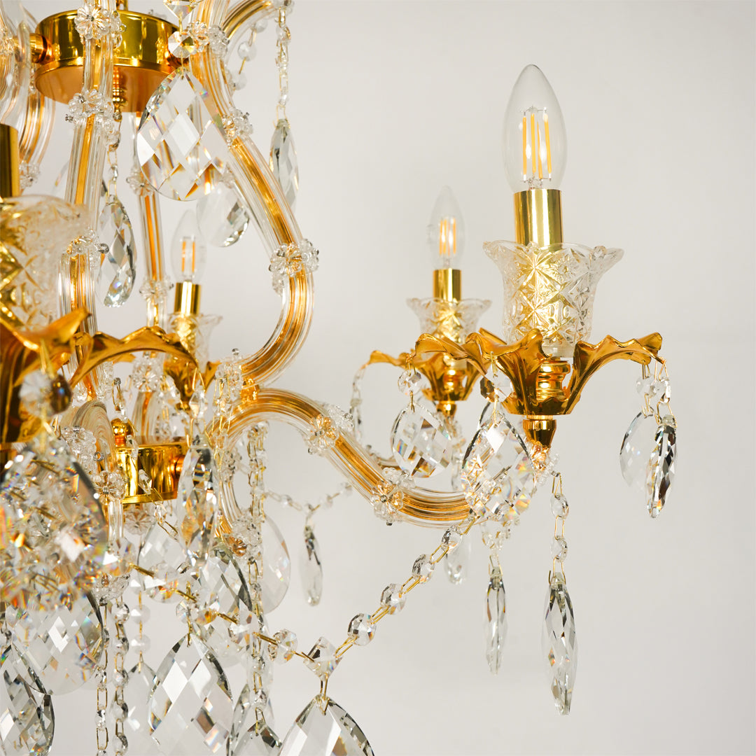 Closeup image of petite clear crystal chandelier for luxury living room decor styling with elegant polished metal finish.