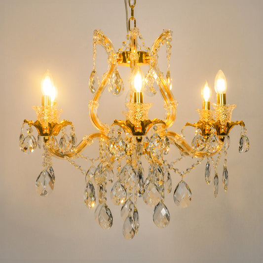 White background image of petite clear crystal chandelier for modern living room decor styling with bright warm lighting.