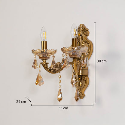 Gold crystal wall sconce with dual bulbs and drops size 30cm height 33cm width 24cm depth shown clearly.