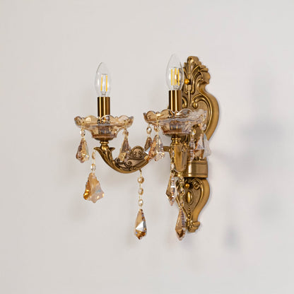 Golden 2 light crystal wall light in candle style design shown switched off on white background for home decor.