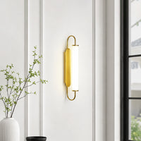 Modern gold metal LED wall light for bedroom hallway living room and luxury home interiors with warm ambient lighting.