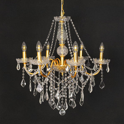 Gold metal crystal chandelier shown on black background highlighting premium crystal detailing for elegant interiors.