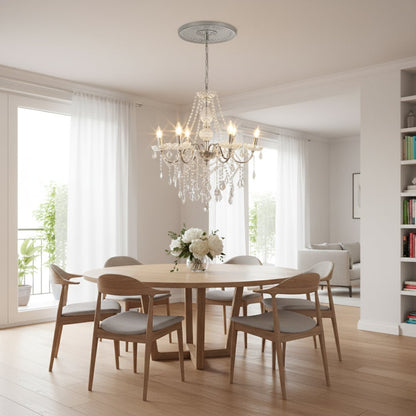 Silver metal crystal chandelier adds bright elegant lighting to living room or dining room ceilings creating a luxury ambience.