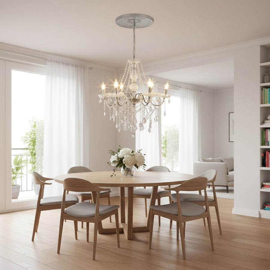Silver metal crystal chandelier adds bright elegant lighting to living room or dining room ceilings creating a luxury ambience.