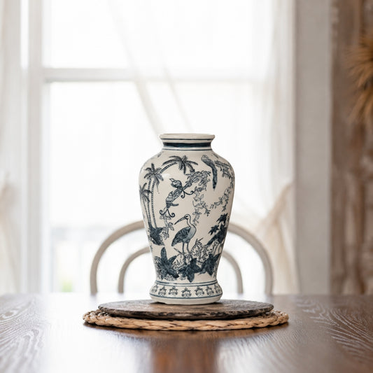 White ceramic decorative jar with blue floral artwork styled on a wooden tray for elegant contemporary home decor.