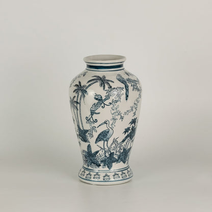 Blue and white ceramic jar with hand painted birds foliage and scenic elements displayed on a plain surface creating a refined traditional decorative accent for interiors.