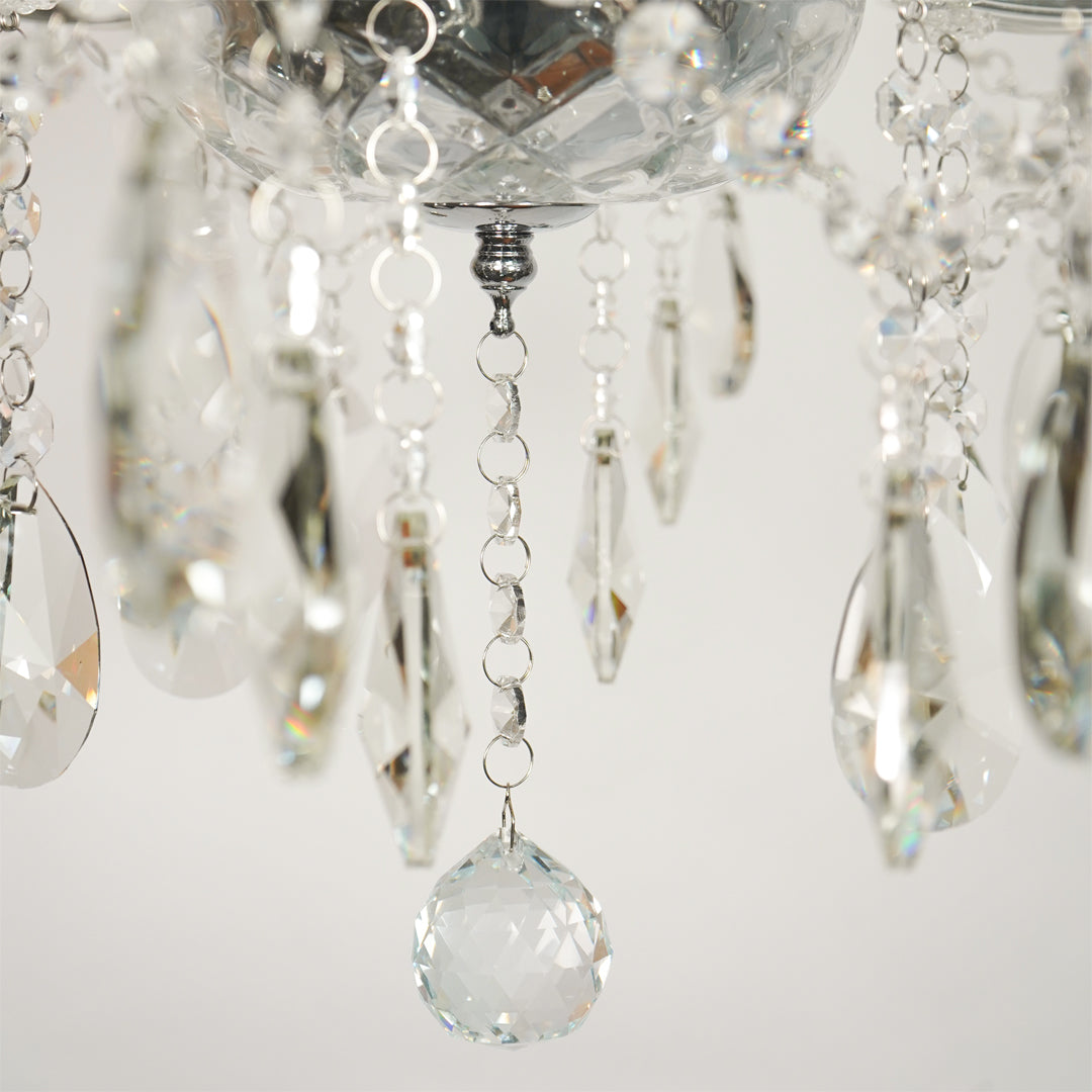 Closeup image of waterfall crystal chandelier for modern dining room decor styling with elegant crystal detailings.