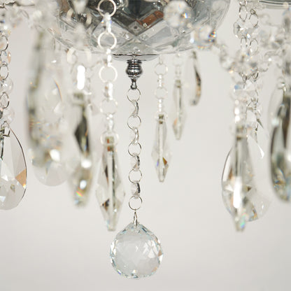 Closeup image of waterfall crystal chandelier for modern dining room decor styling with elegant crystal detailings.
