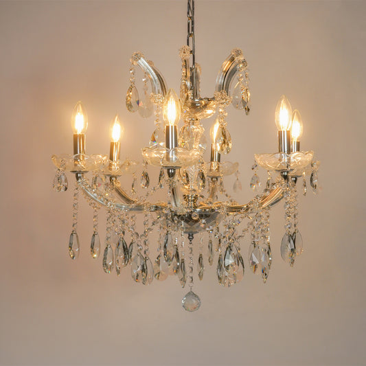 White background image of waterfall crystal chandelier for modern living room decor styling with a bright warm glow.