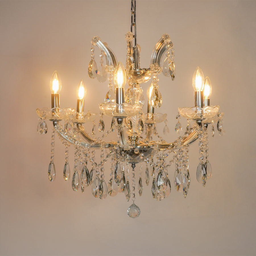 White background image of waterfall crystal chandelier for modern living room decor styling with a bright warm glow.