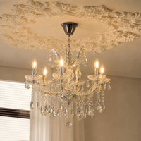 Lifestyle image of waterfall crystal chandelier for luxury living room decor styling with elegant crystal detailing.