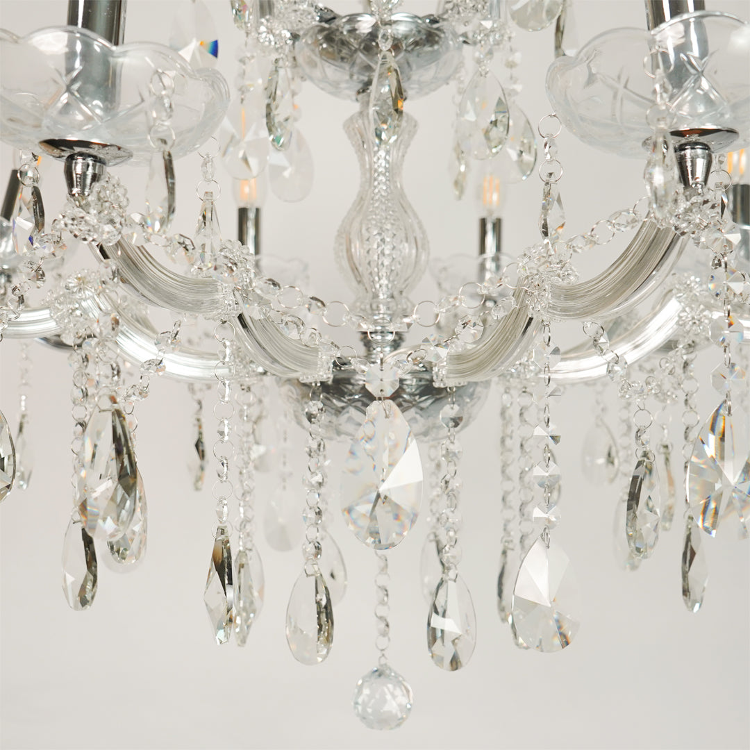 Closeup image of large waterfall crystal chandelier for modern dining room decor styling with elegant crystal detailings.