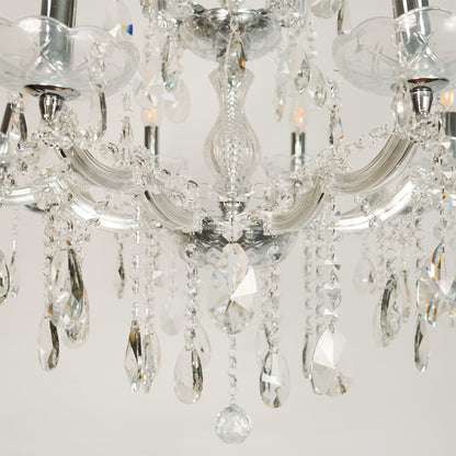 Closeup image of large waterfall crystal chandelier for modern dining room decor styling with elegant crystal detailings.