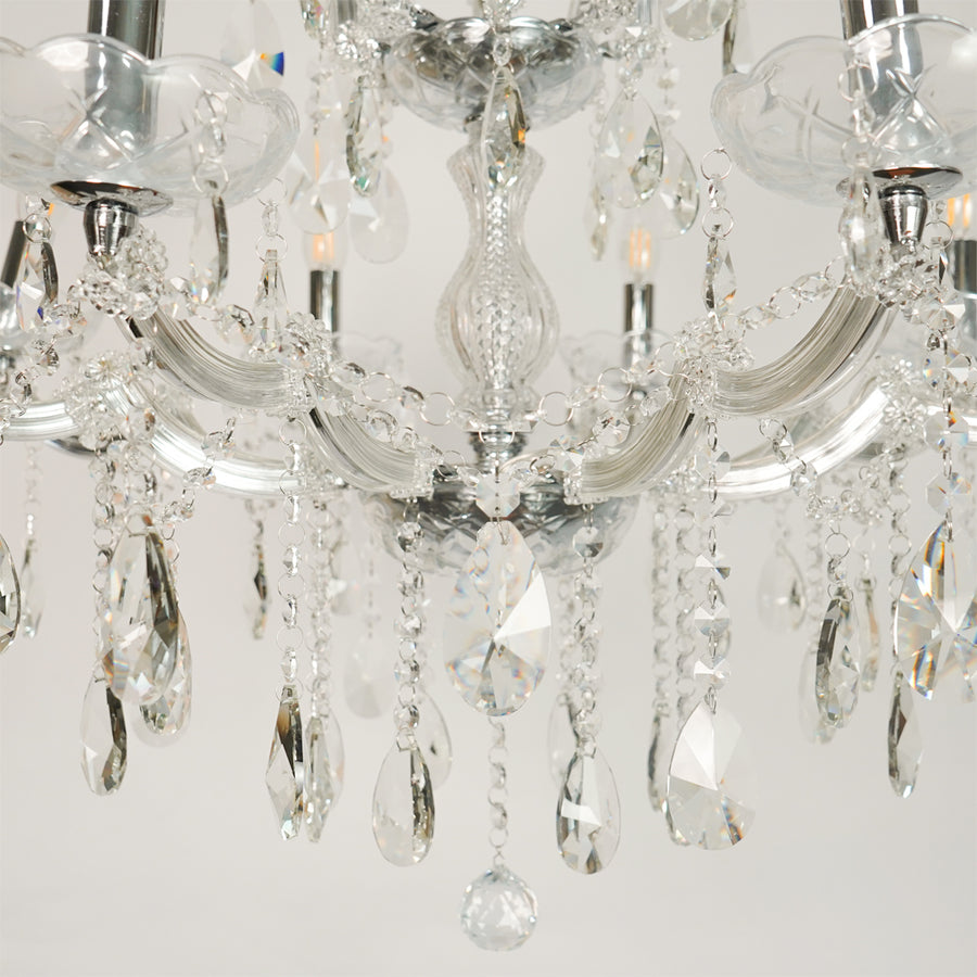 Closeup image of large waterfall crystal chandelier for modern dining room decor styling with elegant crystal detailings.