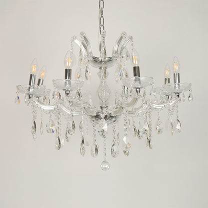 White background image of large waterfall crystal chandelier for elegant dining room decor styling with unlit crystal arms.