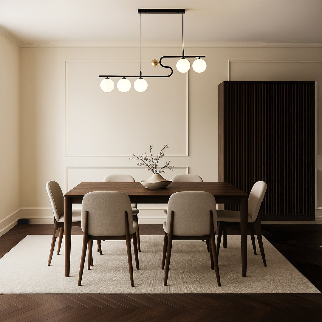 A sculptural black and gold chandelier shining softly above a neutral dining table arrangement adding refined warm LED lighting and sophisticated décor.