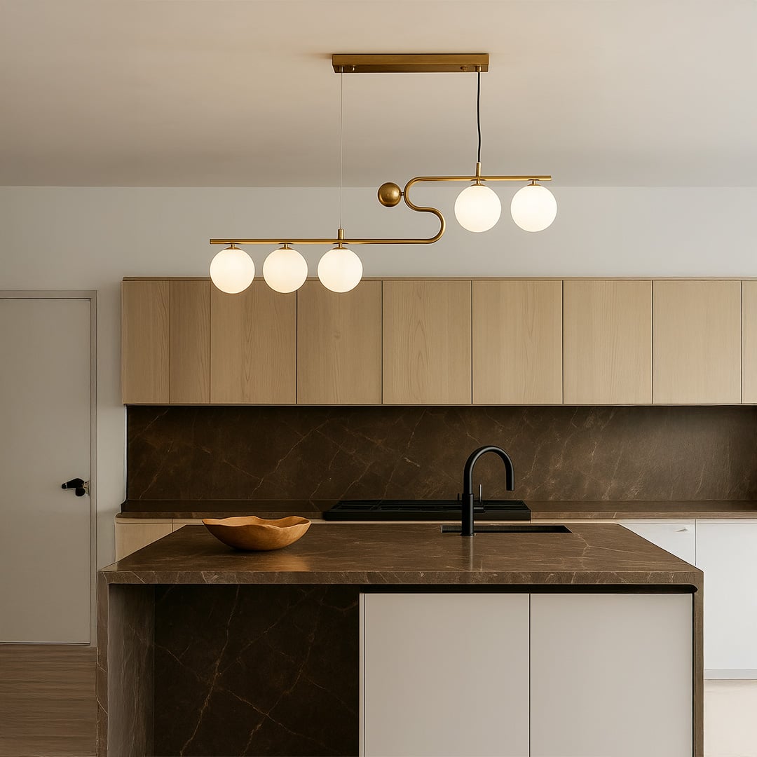 Modern gold ceiling chandelier with white globe lights in a kitchen background with lights on perfect for modern lighting décor and interior design.