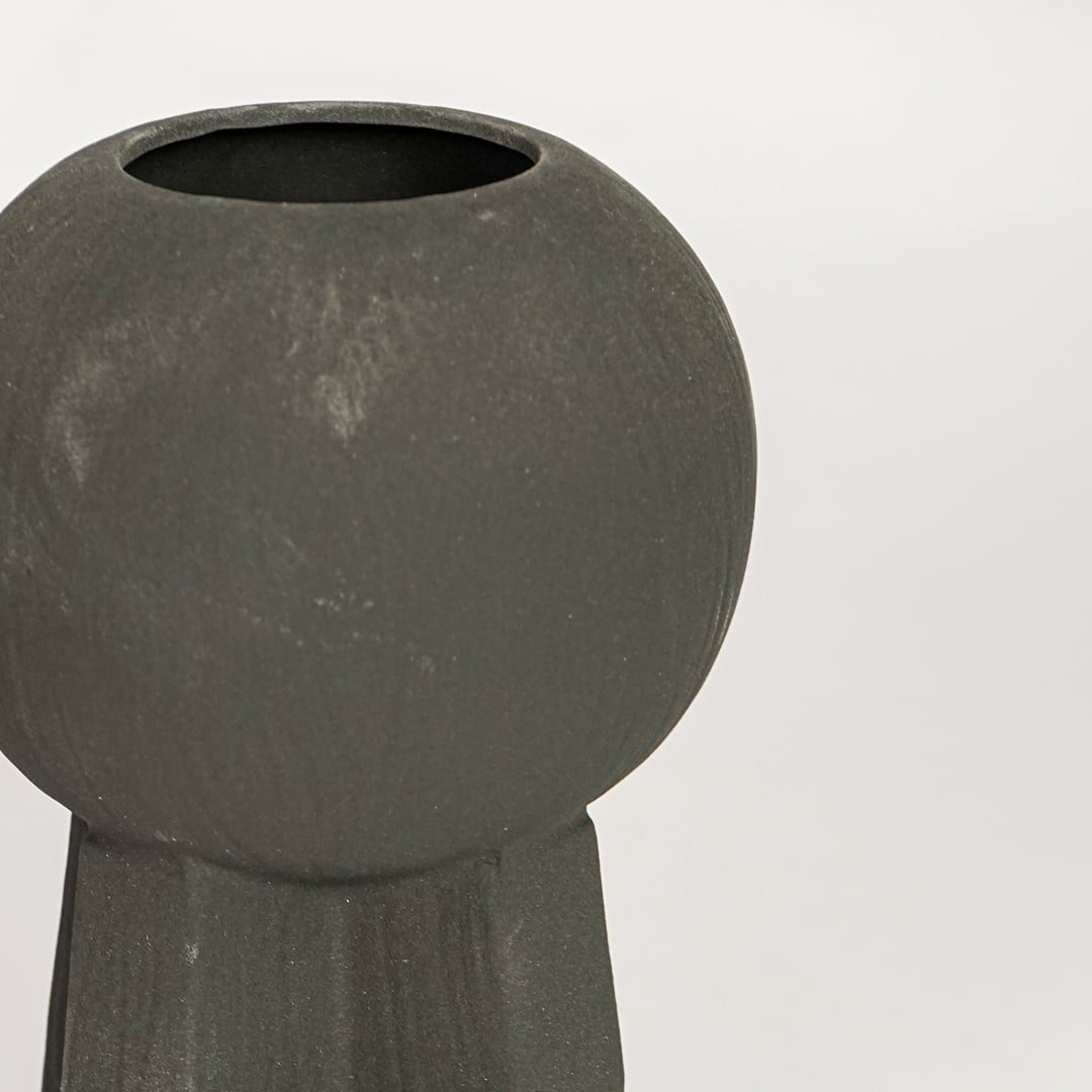 Black ceramic decorative vase with textured surface and sculptural form perfect for elegant dried floral display and interior decor.