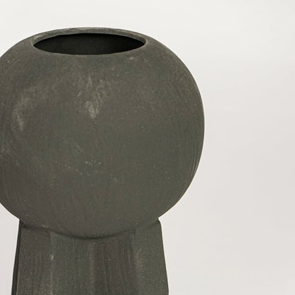 Black ceramic decorative vase with textured surface and sculptural form perfect for elegant dried floral display and interior decor.